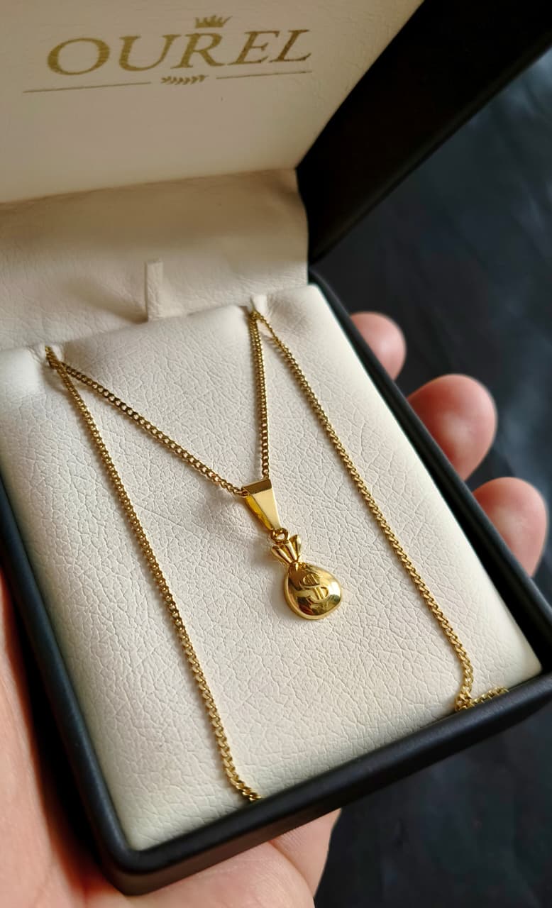 Cadena Cubana 65CM y dije Bolsa de Oro Laminado 18K